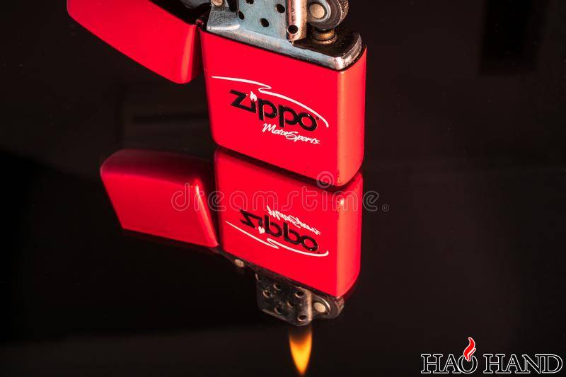 red-zippo-lighter-reflection-shiny-black-background-close-up-red-zippo-lighter-r.jpg