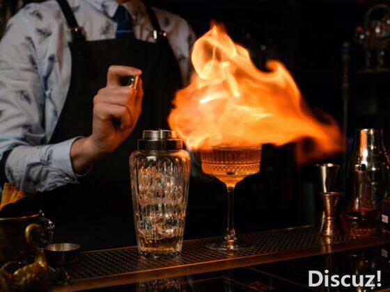 Professional-bartender-spray-and-burn-over-an-alcoholic-drink--560x420.jpg